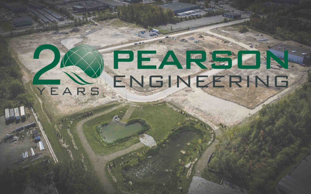 20th anniversary logo over construction site